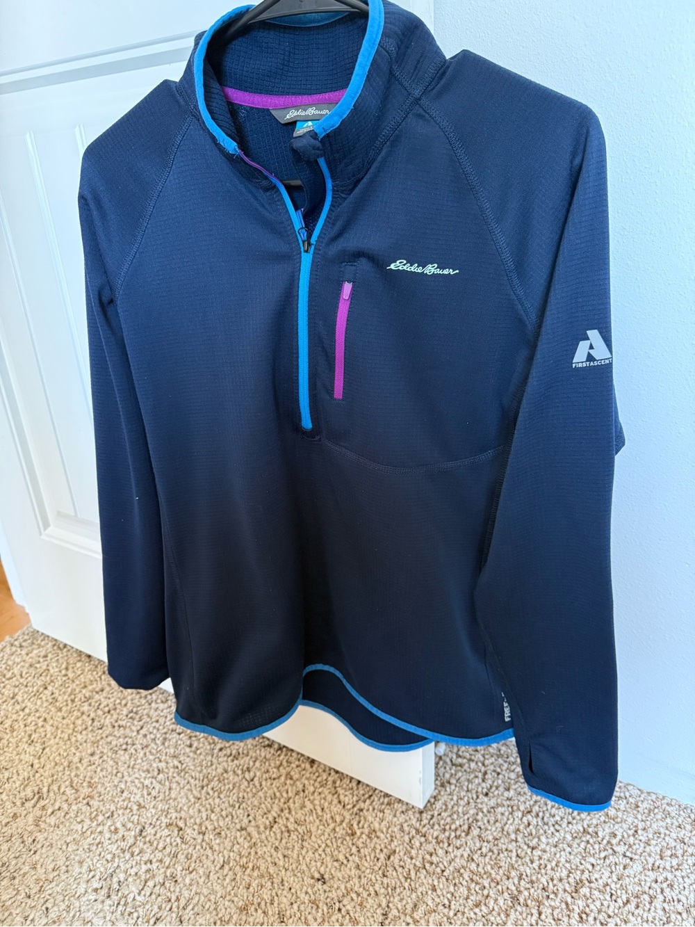 Eddie Bauer navy half-zip pullover with teal trim and pink pocket
